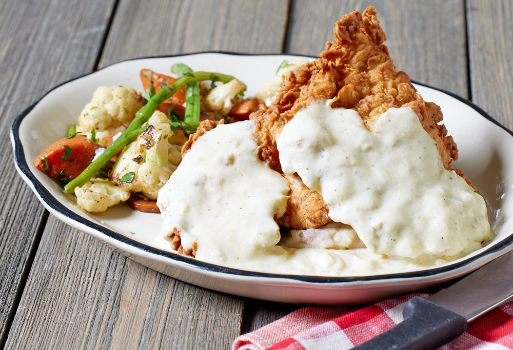 Plate of Fried Chicken on a wood background